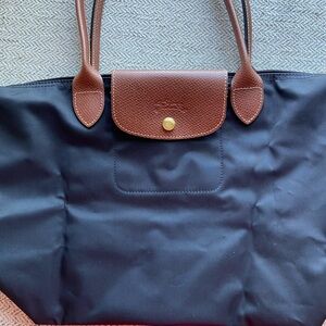 Longchamp LePliage black tote with brown trim